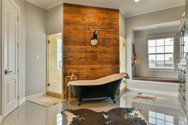 bathroom featuring tile floors, vanity, crown molding, and a tub