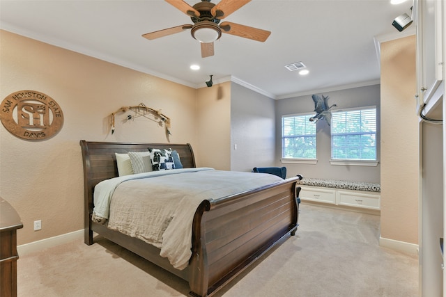 carpeted bedroom with ornamental molding and ceiling fan