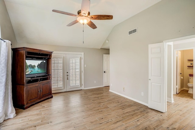 unfurnished living room featuring light wood-style floors, french doors, visible vents, and baseboards