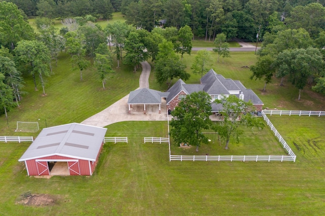 birds eye view of property with a rural view