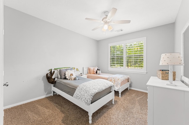 bedroom featuring light colored carpet and ceiling fan