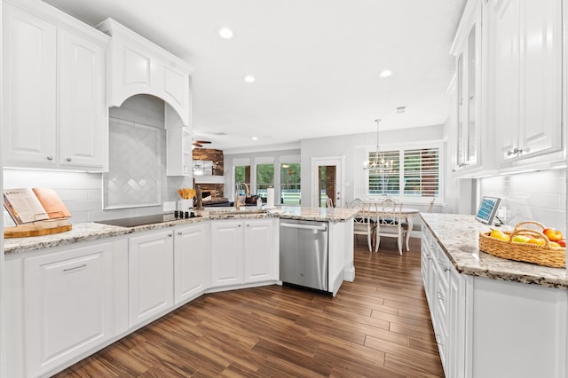 kitchen with dishwasher, white cabinetry, and backsplash