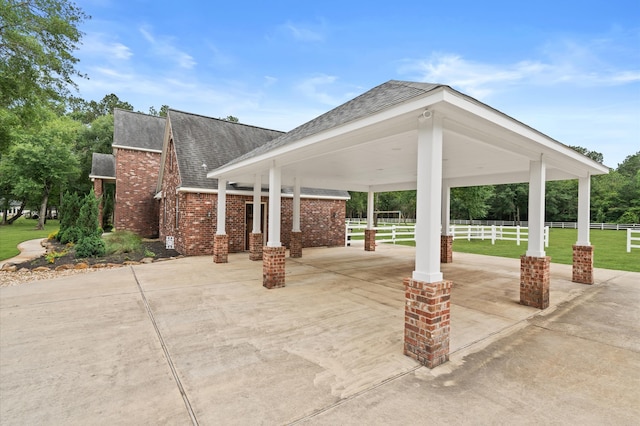 surrounding community with a gazebo and a lawn