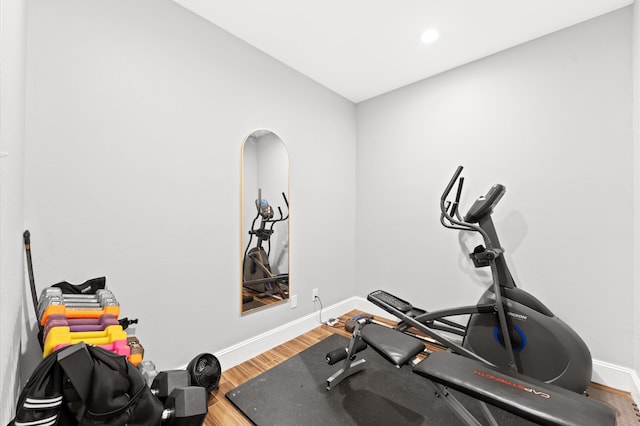 workout room featuring hardwood / wood-style floors