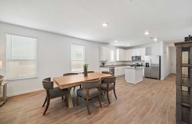 dining room featuring light hardwood / wood-style flooring