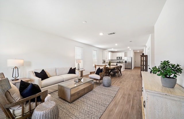 living room with light hardwood / wood-style floors