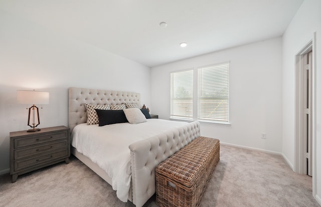 bedroom with light colored carpet