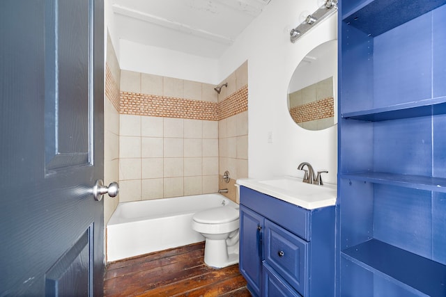 full bathroom featuring wood-type flooring, vanity, toilet, and tiled shower / bath combo