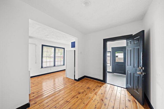 spare room with light hardwood / wood-style flooring