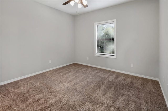 empty room featuring carpet flooring and ceiling fan