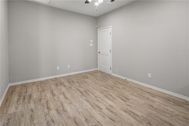 empty room featuring ceiling fan and light hardwood / wood-style flooring