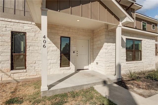 entrance to property featuring a patio