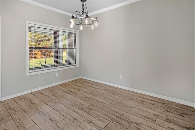 unfurnished room with an inviting chandelier, light hardwood / wood-style flooring, and crown molding