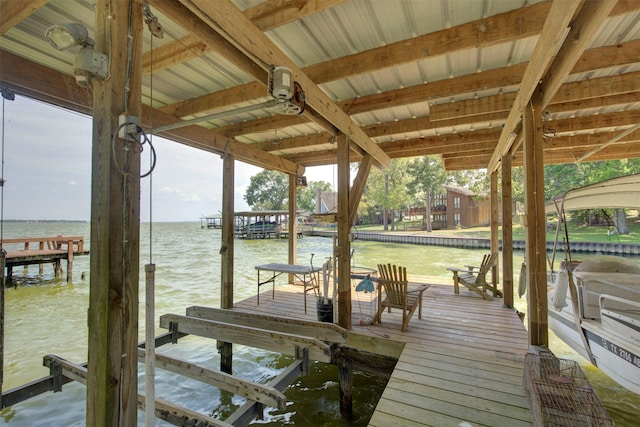 dock area with a water view