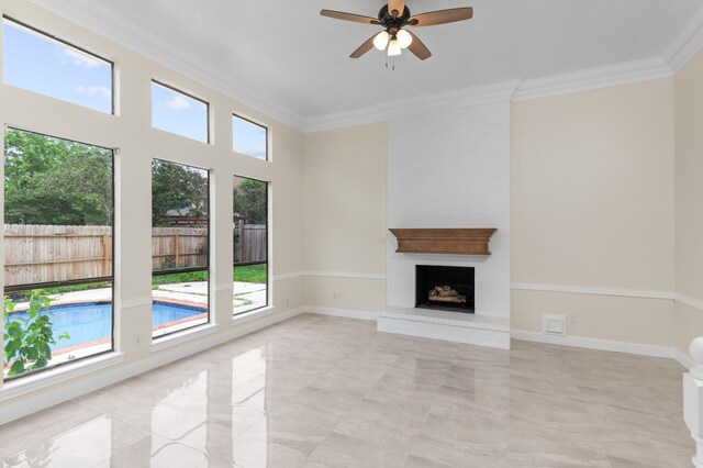 17402 Wilton Park Ct, Spring, TX 77379 - unfurnished living room with crown molding, a brick fireplace, ceiling fan, and light tile floors