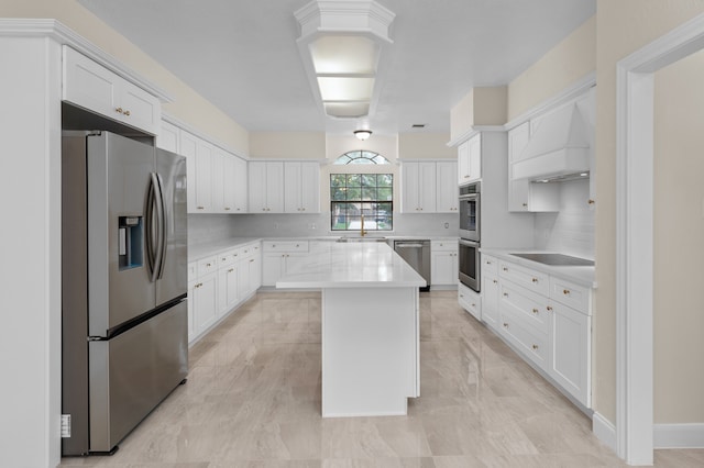 17402 Wilton Park Ct, Spring, TX 77379 - kitchen featuring white cabinets, a kitchen island, custom exhaust hood, and appliances with stainless steel finishes