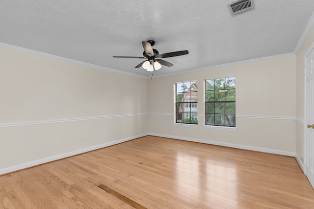 17402 Wilton Park Ct, Spring, TX 77379 - spare room with crown molding, a textured ceiling, ceiling fan, and light hardwood / wood-style flooring