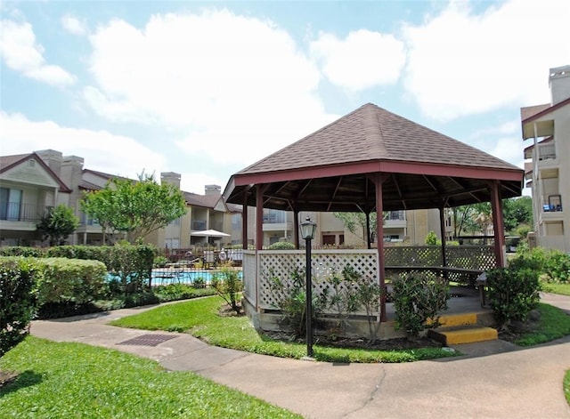 view of property's community featuring a gazebo and a swimming pool