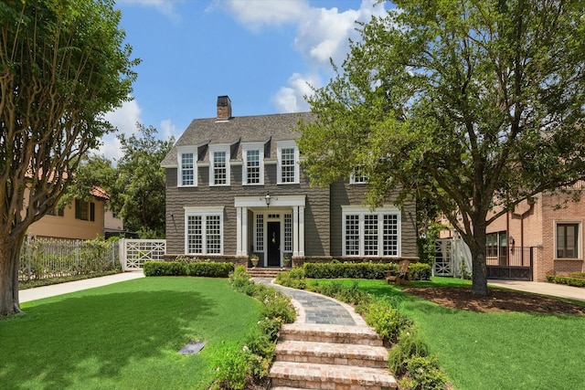 view of front facade with french doors and a front yard