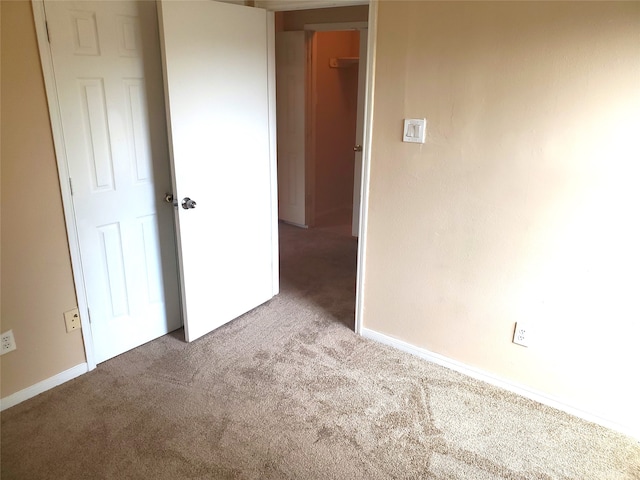 unfurnished bedroom with carpet floors