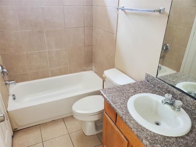 full bathroom featuring tile flooring, toilet, tiled shower / bath combo, and large vanity