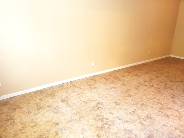 empty room with tile floors