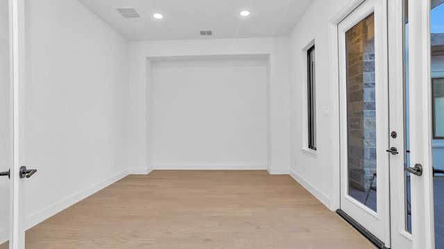 corridor featuring light wood-type flooring