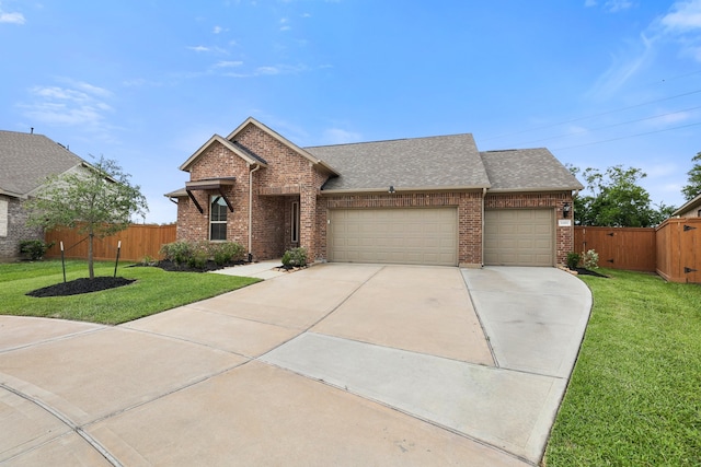 view of front facade with a garage and a front lawn