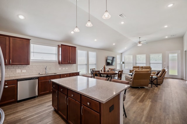 kitchen featuring sink, hardwood / wood-style flooring, dishwasher, hanging light fixtures, and lofted ceiling