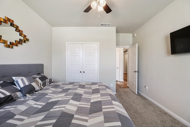 unfurnished bedroom featuring carpet, a closet, and ceiling fan