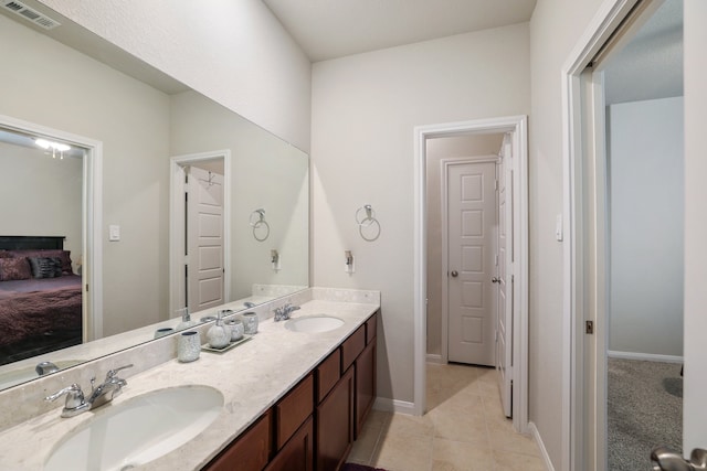 bathroom with tile patterned flooring and vanity