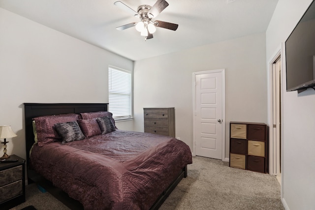 bedroom featuring light carpet and ceiling fan