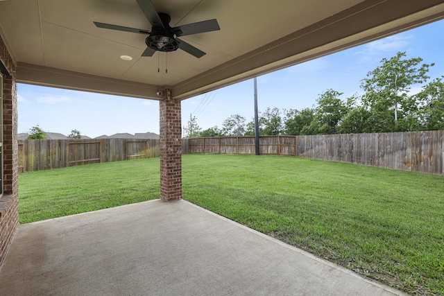 view of yard featuring ceiling fan and a patio area