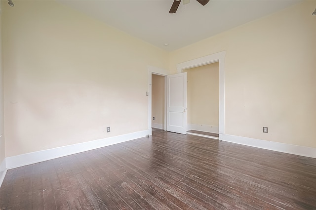 unfurnished room featuring ceiling fan and dark hardwood / wood-style flooring