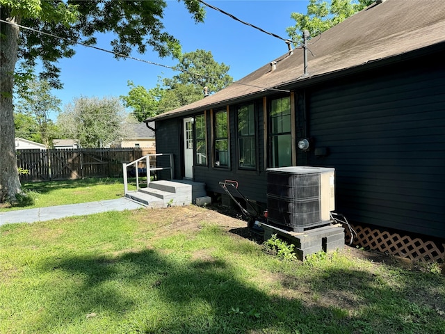 view of yard with central AC