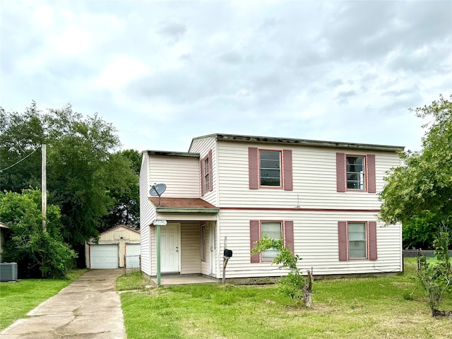 view of front of home featuring central AC, an outbuilding, a front lawn, and a garage