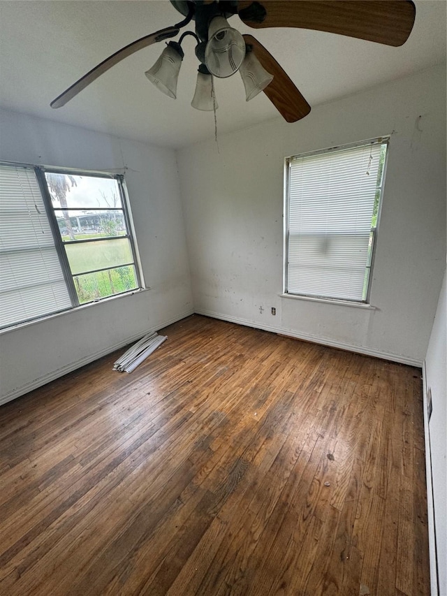 unfurnished room with dark wood-type flooring