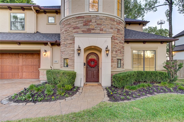 view of exterior entry featuring a garage