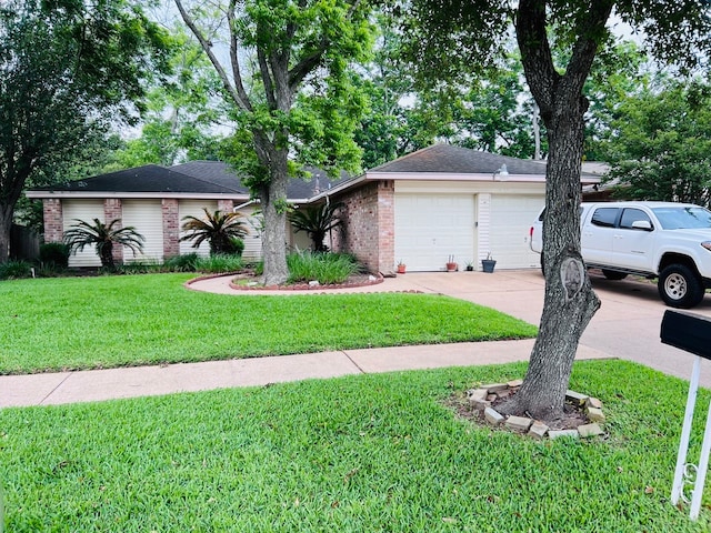 ranch-style home featuring a garage and a front yard