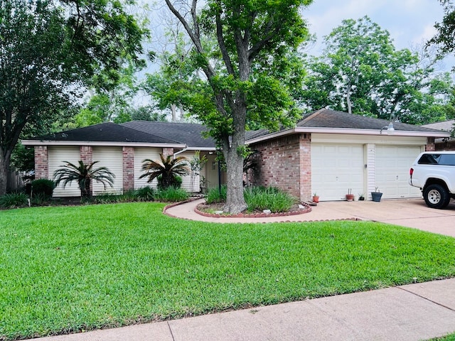 single story home with a garage and a front yard