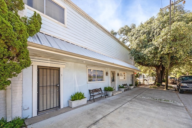 view of property exterior featuring a patio area