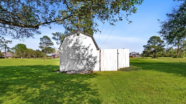 view of outbuilding featuring a yard