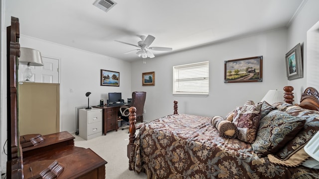 carpeted bedroom with ceiling fan and crown molding