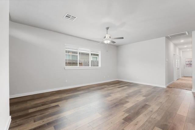 empty room with wood-type flooring and ceiling fan