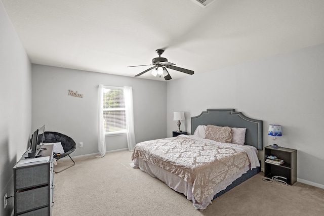 bedroom with ceiling fan and carpet floors