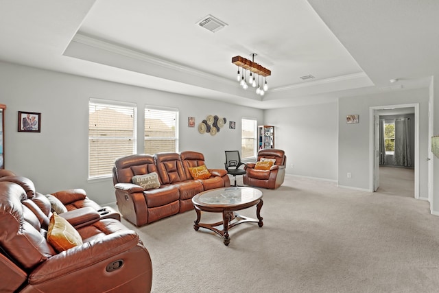 carpeted living room featuring a raised ceiling