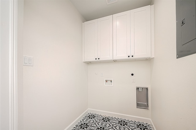 laundry area featuring tile floors, washer hookup, hookup for an electric dryer, and cabinets