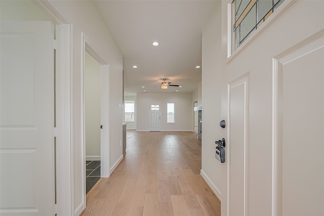 corridor featuring light hardwood / wood-style floors