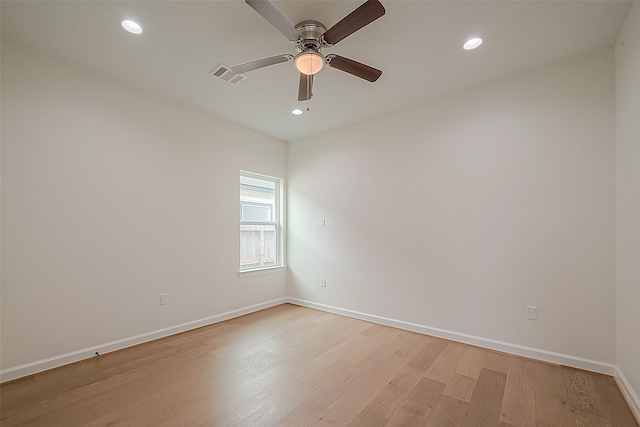 unfurnished room with ceiling fan and light hardwood / wood-style flooring