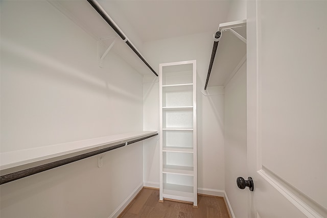 walk in closet featuring hardwood / wood-style flooring